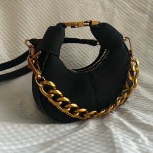 Chic Black Handbag with Gold Chain